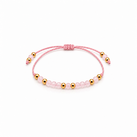Bracelet quartz rose et perles dorées entier sur fond blanc