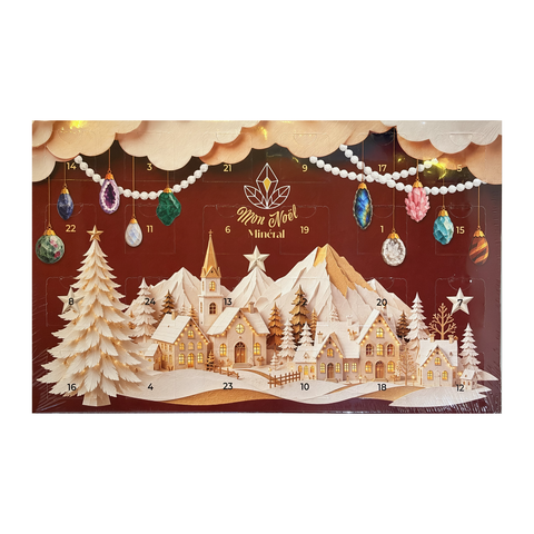 Calendrier de l’Avent Mon Noël minéral de face, décor de village enneigé, avec 24 fenêtres numérotées.