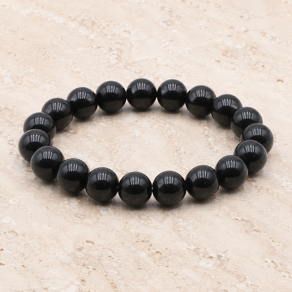 Bracelet en obsidienne noire à perles de 10 mm, vue complète sur pierre claire