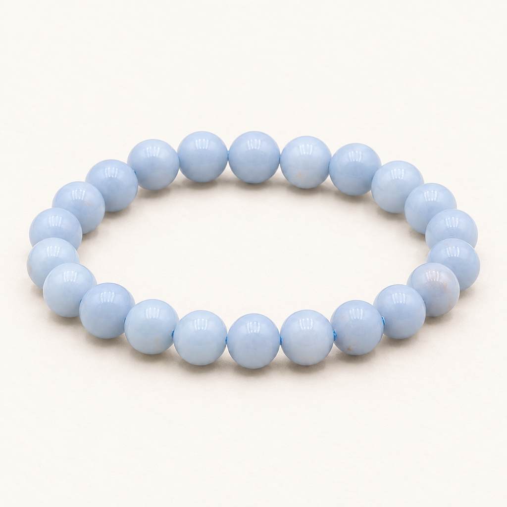 Bracelet en angélite 8 mm - 16 à 18 cm sur fond Nacre MilAura