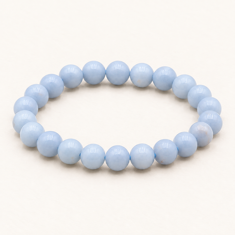 Bracelet en angélite 8 mm - 16 à 18 cm sur fond Nacre MilAura