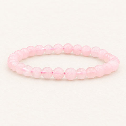 Bracelet en quartz rose du Brésil 6 mm - 16 à 18 cm sur fond Nacre MilAura