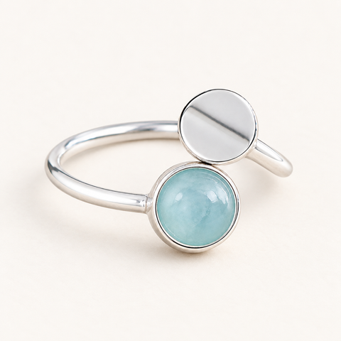 Bague ouverte en argent 925 et aigue-marine 7 mm sur fond Nacre MilAura