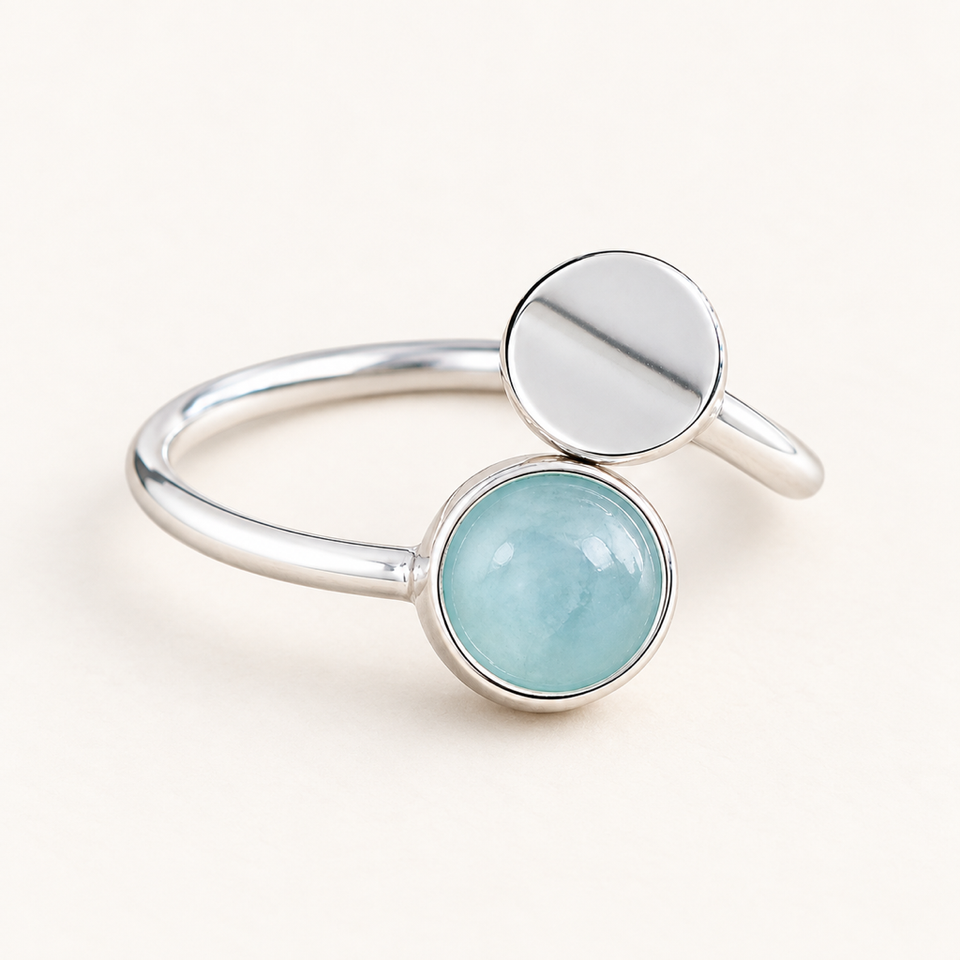 Bague ouverte en argent 925 et aigue-marine 7 mm sur fond Nacre MilAura