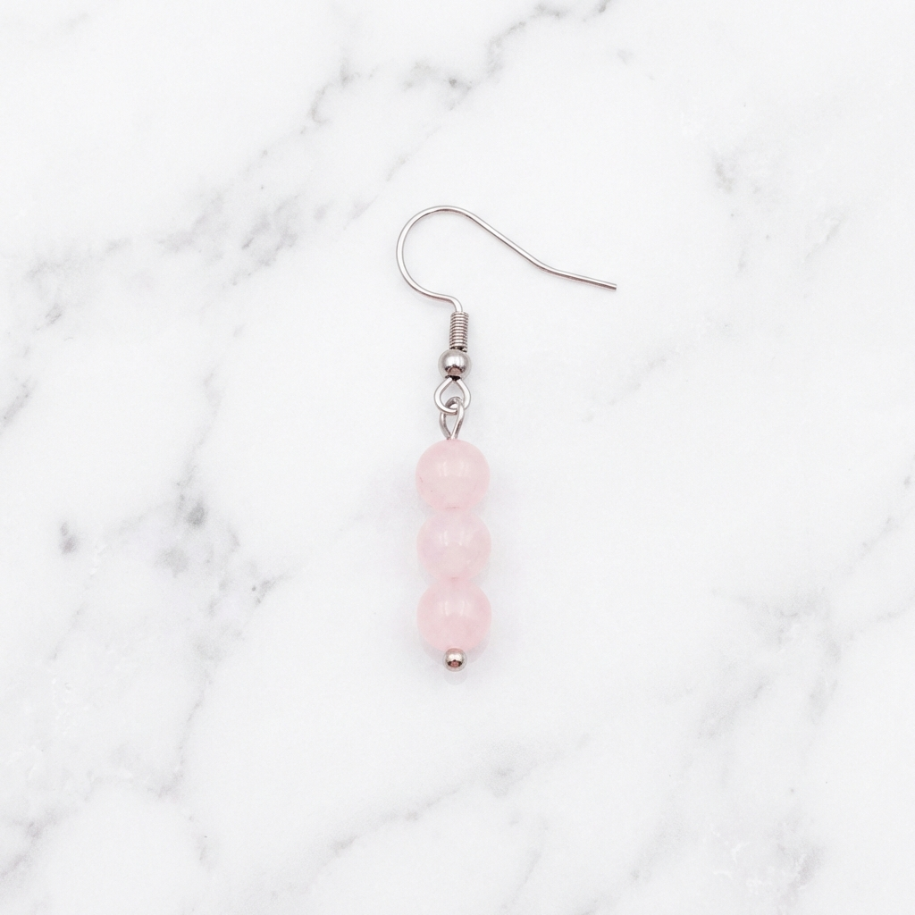Boucles d'Oreilles Quartz Rose — Photo produit sur marbre