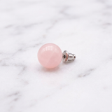 Boucles d'Oreilles Quartz Rose — Photo produit sur marbre